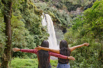 Tourists observing the Kimsa Waterfall, located in the Rumiñahui canton, 15 kilometers from...