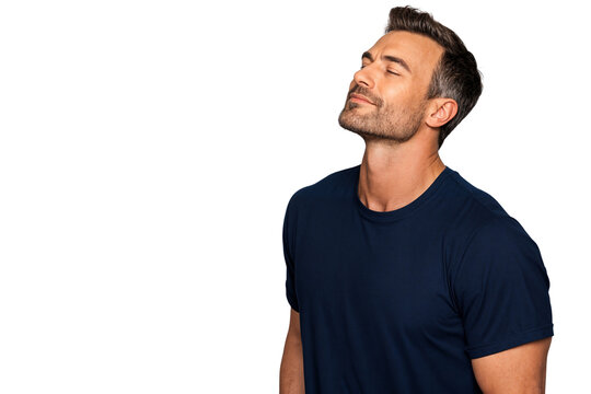 Portrait of a relaxed man in navy blue shirt with eyes closed and smiling slightly, enjoying a peaceful moment. Isolated on transparent background