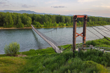 footbridge with rails over Koksa river