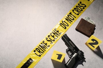 Forensic expertise. Crime scene with evidence, markers and police tape on light grey background,...