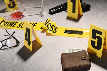 Forensic expertise. Crime scene with evidence, markers and police tape on light grey background,...