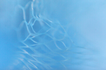 Abstract Blue Mesh: Close-up of an abstract, ethereal blue mesh, evoking a sense of delicate structure and gentle serenity.