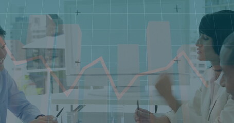 In office, businessman analyzing financial graph image on computer screen