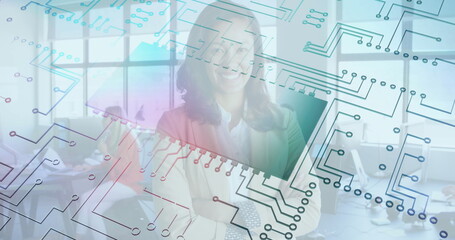 In office, smiling woman with circuit board pattern overlay, creating image
