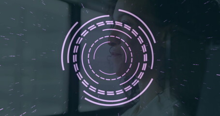 Gazing female figure studying HUD rings in dark lab near multi-pane window, with purple hologram