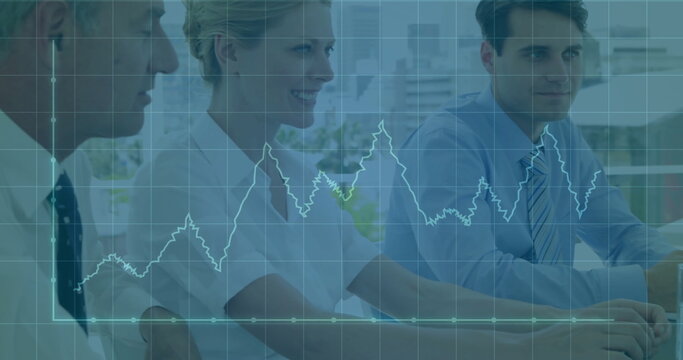 In business meeting, diverse professionals discussing financial graph image at table