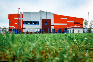 Orange sports and recreation complex building in small town.
