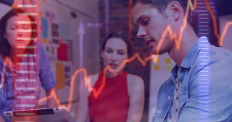 Analyzing man in denim shirt studying data in office, with chart overlays, copy space