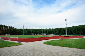 Running track on the stadium. Treadmill on sport field.