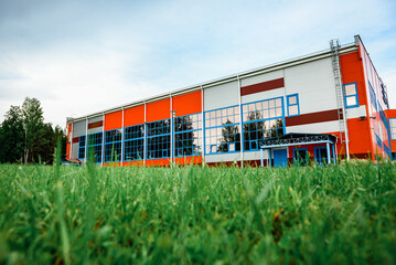 Orange sports and recreation complex building in small town.