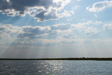 cloudscape on the calm lake in Chobe National Park