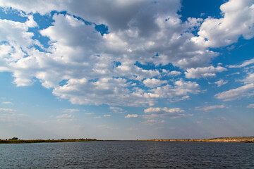 cloudscape on the calm lake in Chobe National Park