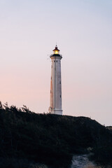 A lighthouse at sunset