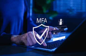 MFA, Multi-Factor Authentication Security Concept. Person typing on laptop with MFA shield icon and login interface, representing multi factor authentication, secure login, cybersecurity protection.