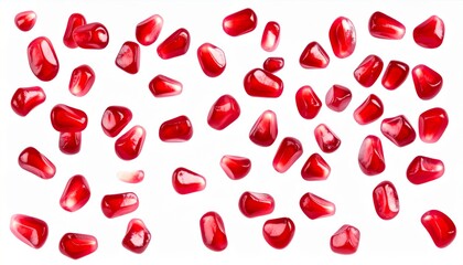 Red Pomegranate Seeds Scattered on White Background