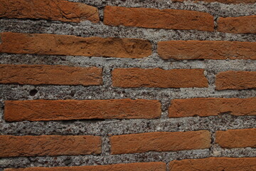 Ancient red bricks textured background wallpaper. Red bricks wall in Rome