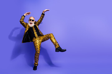 Eccentric elderly gentleman in a vibrant gold suit dancing against a vibrant purple background exuding confidence and joyous energy