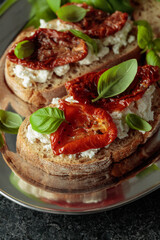 Ciabatta with sun dried tomatoes in olive oil, ricotta and basil.