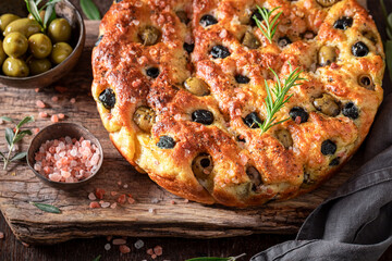 Traditional focaccia with olive oil and olives.