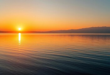 Naklejka premium Golden hour sunlight paints vibrant hues across calm lake at sunrise, idyllic, colors