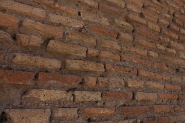 Ancient red bricks textured background wallpaper. Red bricks wall in Rome