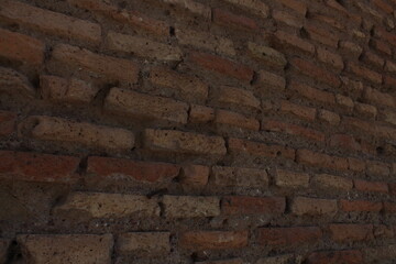 Ancient red bricks textured background wallpaper. Red bricks wall in Rome