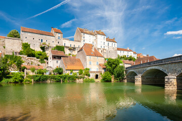 Historic French Village by a Serene Riverbank