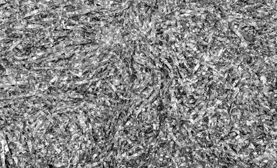 Festive shiny silver tinsel background. The texture of sliced ​​crumpled foil.