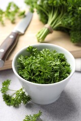 Fresh cut parsley on light table, closeup