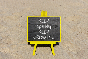 Keep going and growing symbol. Concept words phrase Keep going keep growing on beautiful black...