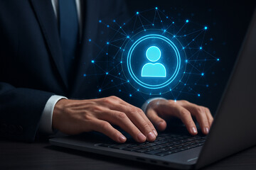 Man typing on laptop with blue person icon and network graphic overlay representing digital identity
