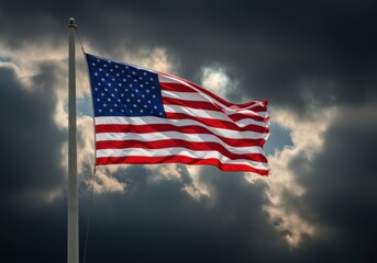 An american flag waves against a dramatic stormy sky background