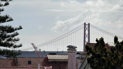 Rustic rooftops basking under Lisbon's iconic suspension bridge, evoking Fado festival reflections and European cityscape wanderlust dreams