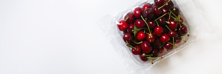 A cascade of glistening cherries in plastic, echoing the vernal awakening of Hanami, whispers of juicy indulgence