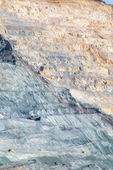 Gigantic quarry walls reveal earthen secrets, echoing mining heritage, Earth Day reflection,...