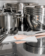 Glistening culinary symphony of steel and reflection, evoking Kitchen Warriors' Day prep or Wok Appreciation Week ambiance