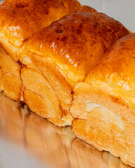 Golden, fluffy milk bread loaves shimmer enticingly, embodying a soulful Tsukimi gathering, radiating buttery warmth and lunar nostalgia