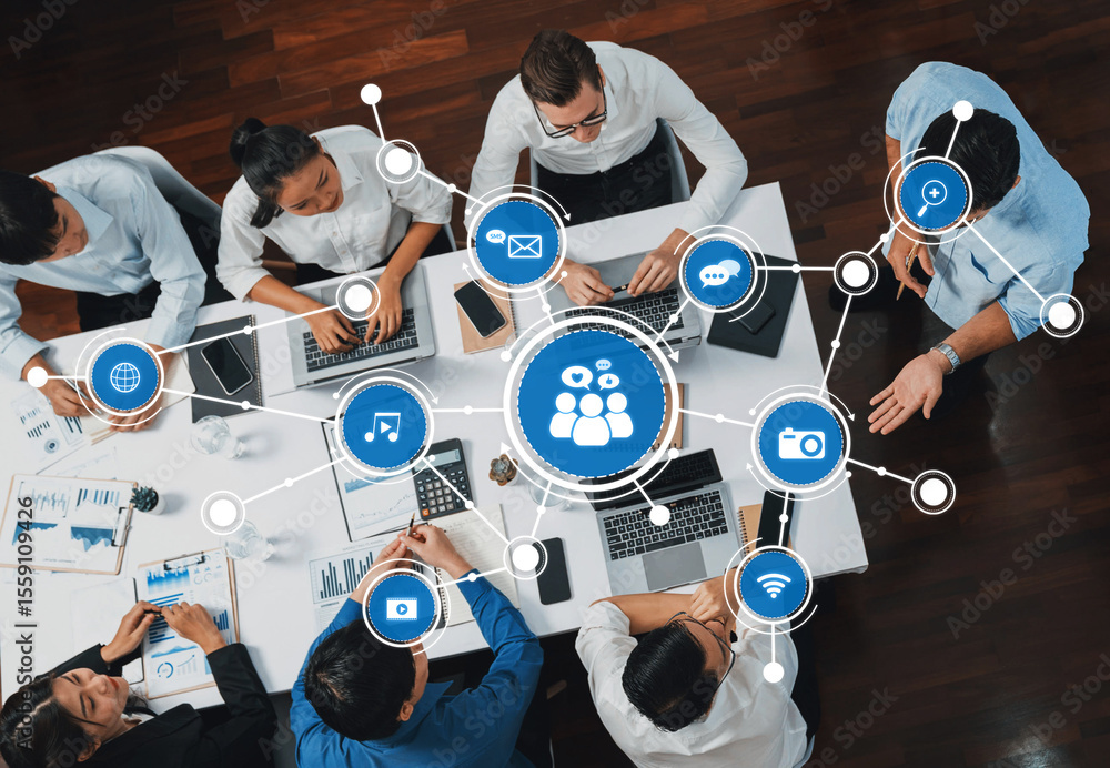 Poster A diverse team collaborates using laptops and digital tools in a modern office, illustrating real-time networking and communication concepts through various visuals. Amity