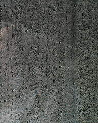 Condensation on a window evokes urban morning mist, cozy hygge retreat, refreshing monsoon embrace,...