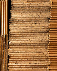 Rustic corrugated cardboard stacks, evoking Pachamamas earthy texture, prime for creative...