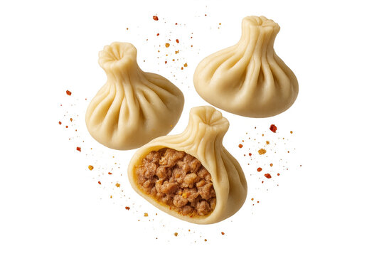 Delicious Georgian khinkali dumplings, one cut open, isolated on transparent background