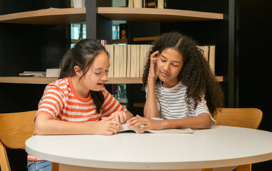 Kid child girl students group together happy smile talking look reading book enjoy in school public library. Learning education knowledge development on storytelling funny fantasy stories at school