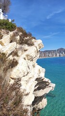 Coastal cityscape of Benidorm, Spain, featuring sandy beaches, clear blue water, and modern...