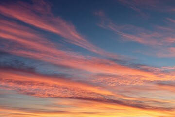 Fototapeta premium Striking Cloudscape at Sunset Vertical View of Pink, Orange, and Blue Hues in the Sky