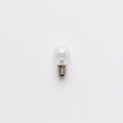 Single spare car bulb placed neatly on white background