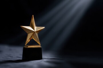 Shining gold star award on black background with dramatic lighting