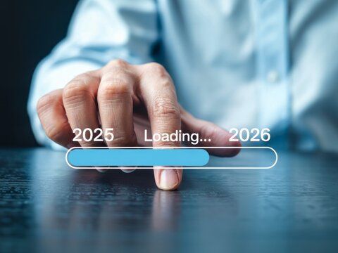 A person progresses from year 2025 to 2026 with a loading progress bar on a virtual interface symbolizing growth