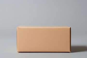 Obraz premium Brown Cardboard Box on Gray Background Minimalist Product Photography