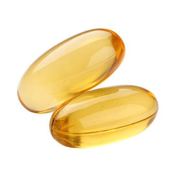 Two golden omega three capsules exhibit clarity and purity on a stark white backdrop, representing health and wellness.