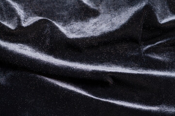 Black velvet fabric with folds